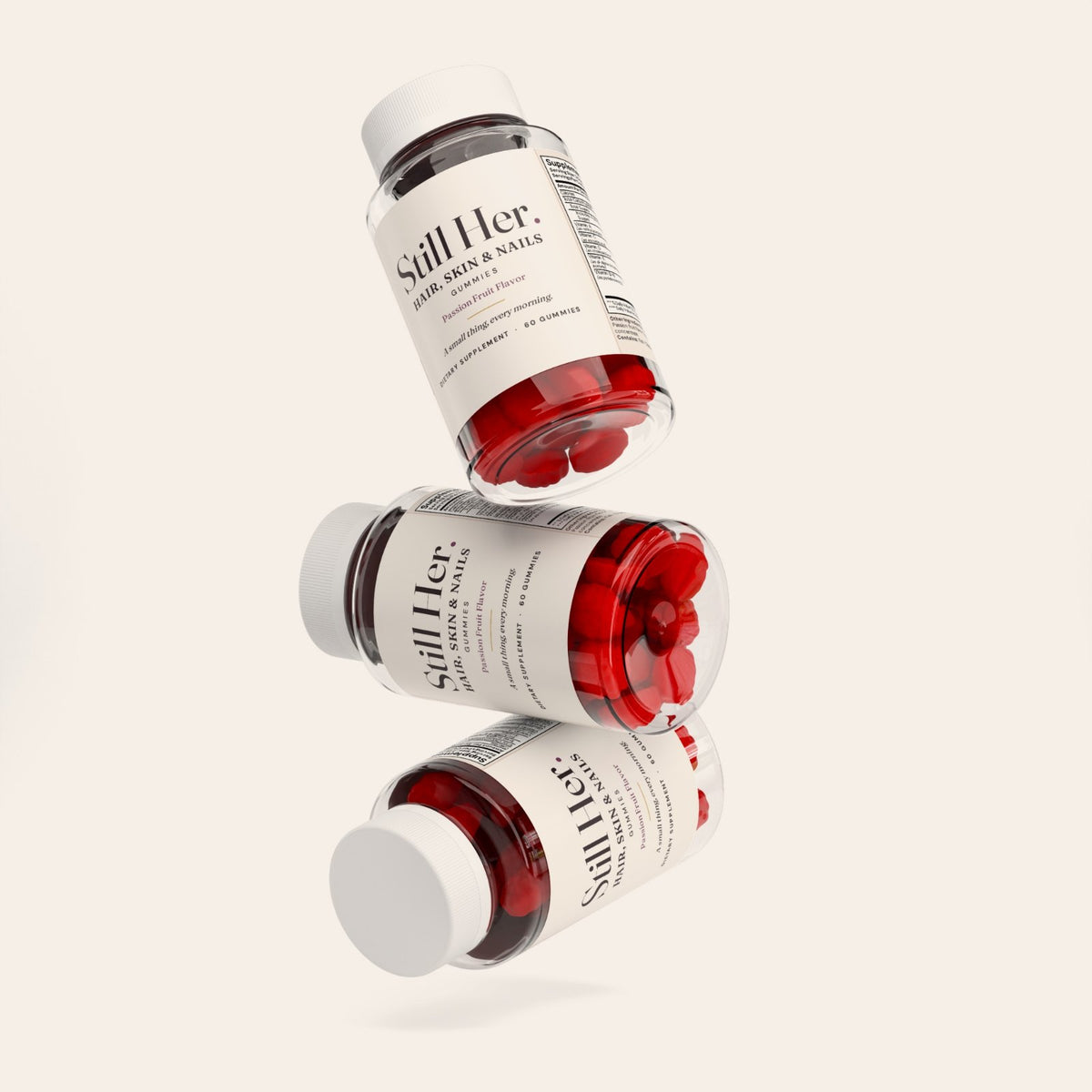 Three bottles of Still Her. Hair, Skin & Nails Gummies